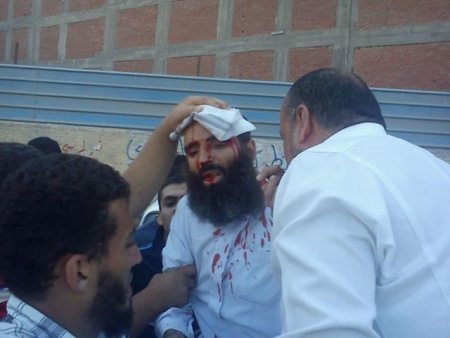 ملف:رغم النيران والخرطوش.jpeg