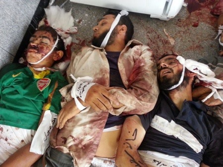 جانب من صور شهداء المجزرة ملف مصور.jpg